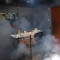 Clouds of insecticide seep into a dining room during a fumigation operation to help control the spread of dengue fever, in downtown Pucallpa, Peru