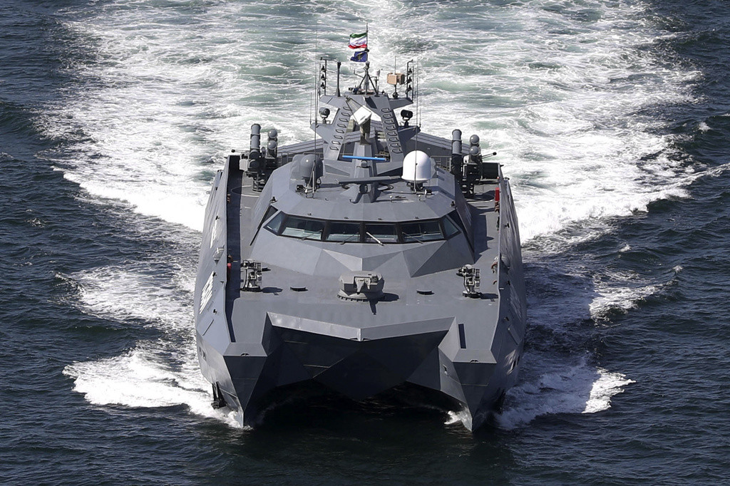 A catamaran moves in the Iranian waters prior to the start of a joint naval drill of Iran, Russia and China in the Indian Ocean